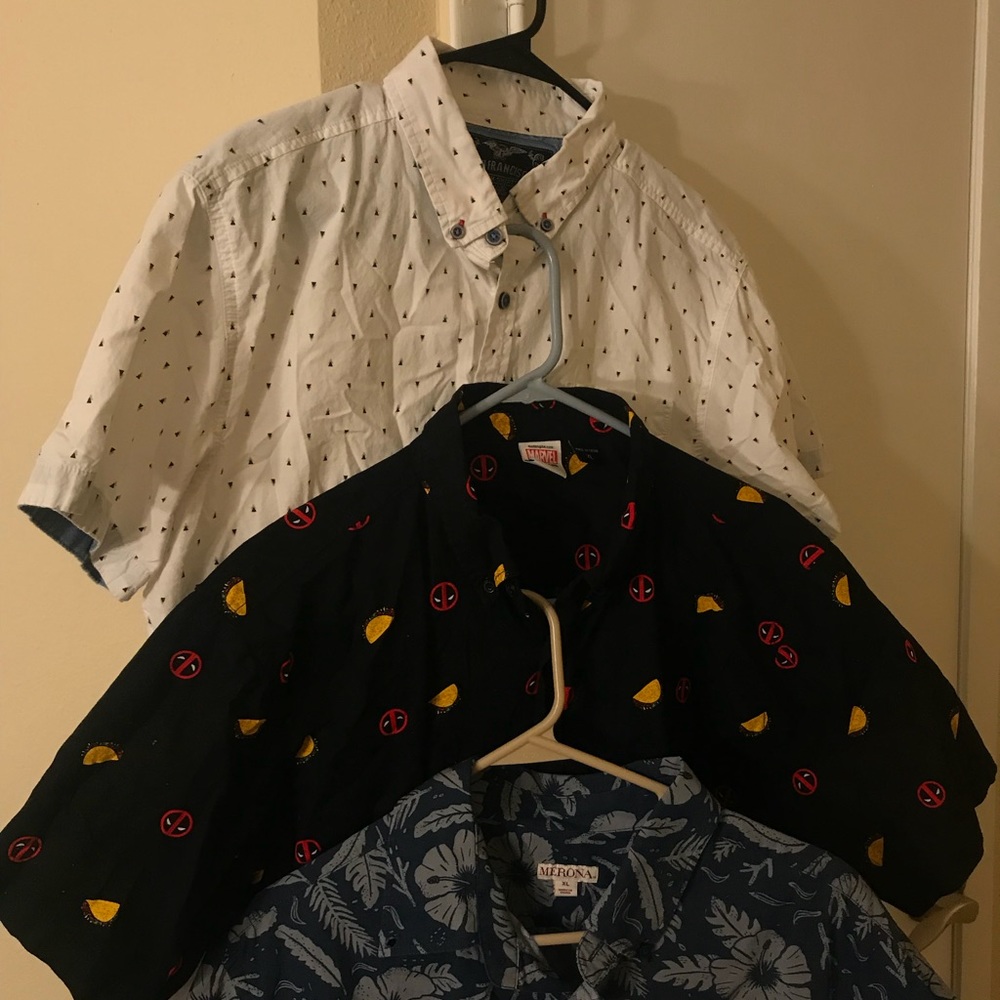 Three short sleeve large button up tees